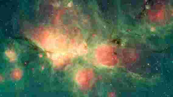 Spitzer观察了猫爪状星云中新生泡泡的气泡