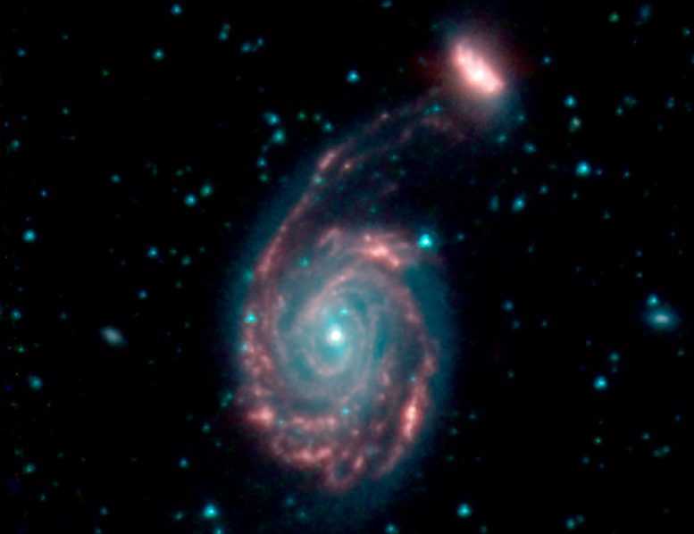 Spitzer图片在宇宙碰撞的尖端上显示星系